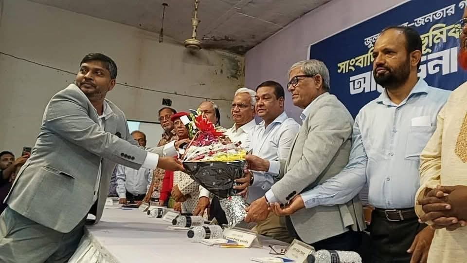 Mirza Fakhrul Islam Alamgir, Secretary General of the Bangladesh Nationalist Party (BNP) was handing over a  floral wreath to Dr Imran Ansari 