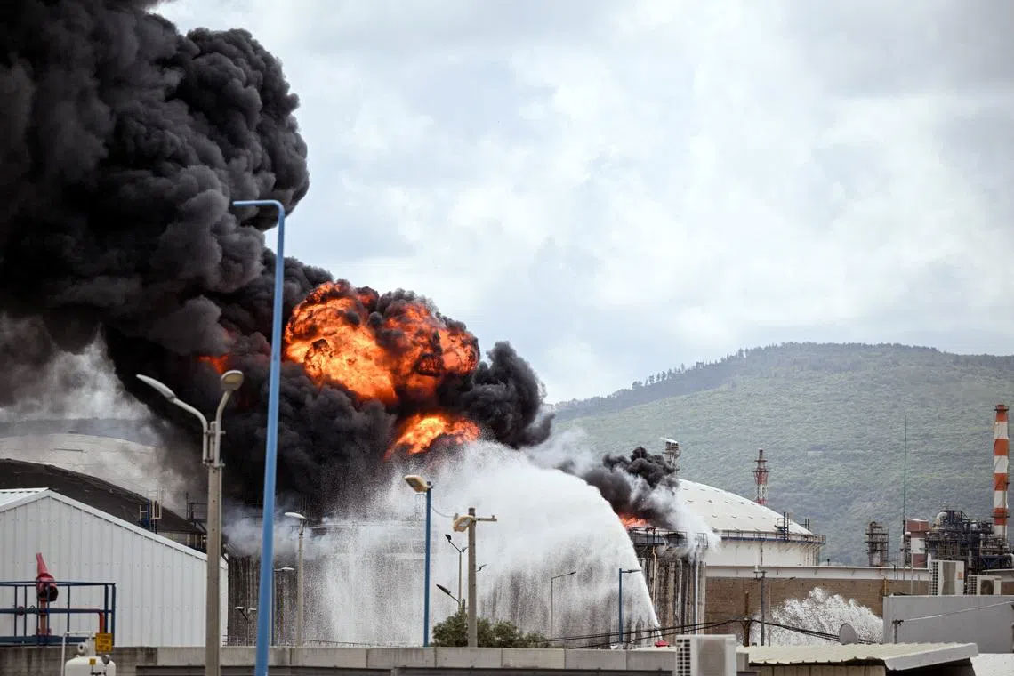 Iran fires missiles across Middle East as Trump threatens oil hub